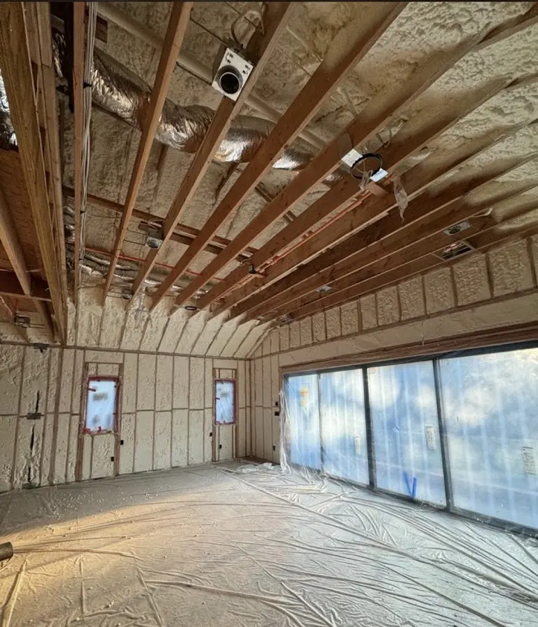 Interior walls and ceiling insulated with spray foam during new construction in St. Louis
